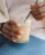 li-woman-holding-shake.webp